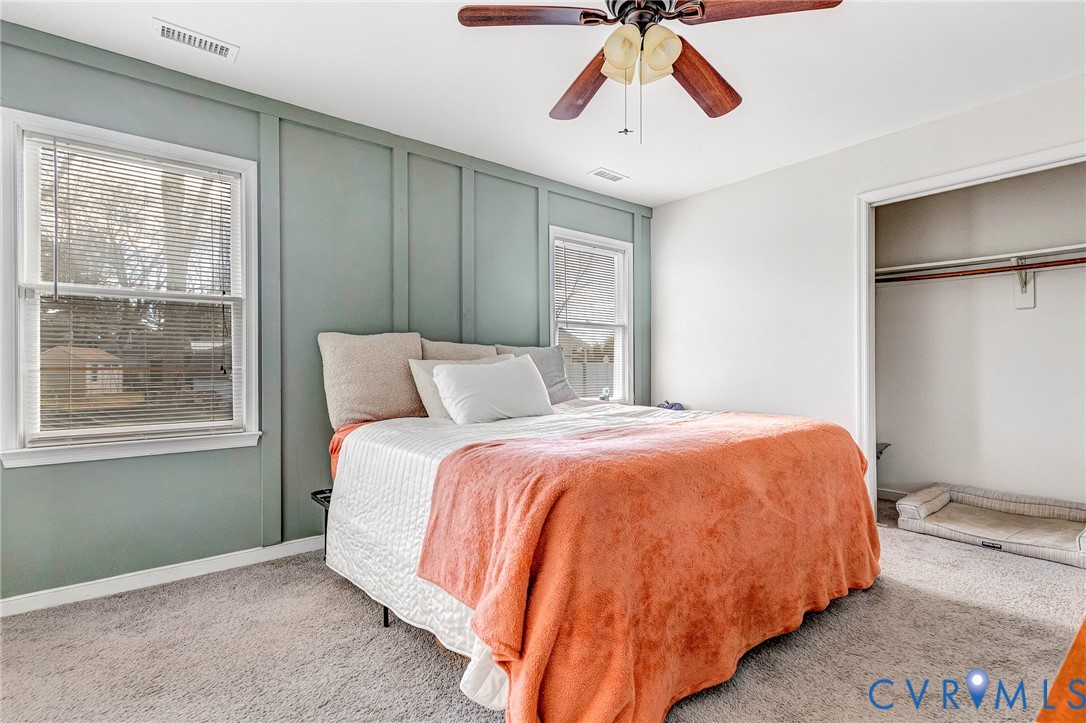 6377 Sledds Lake Road Mechanicsville, VA 23111 - Photo 11 of 15 a bedroom with a bed and wooden floor