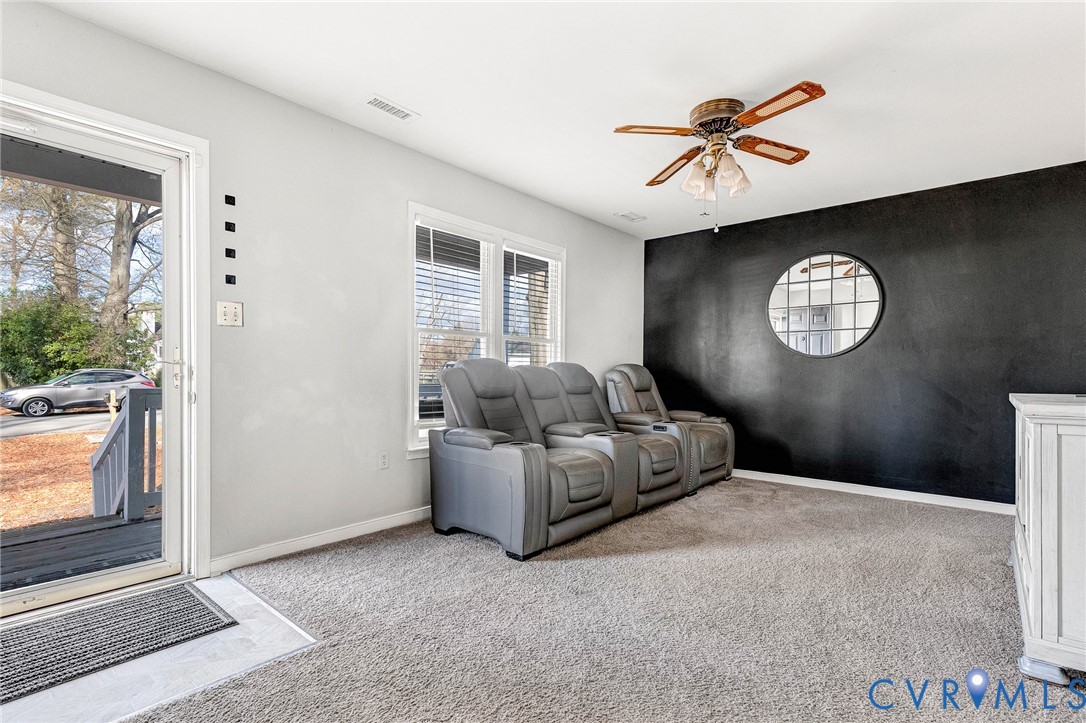6377 Sledds Lake Road Mechanicsville, VA 23111 - Photo 2 of 15 a living room with furniture a window and a ceiling fan