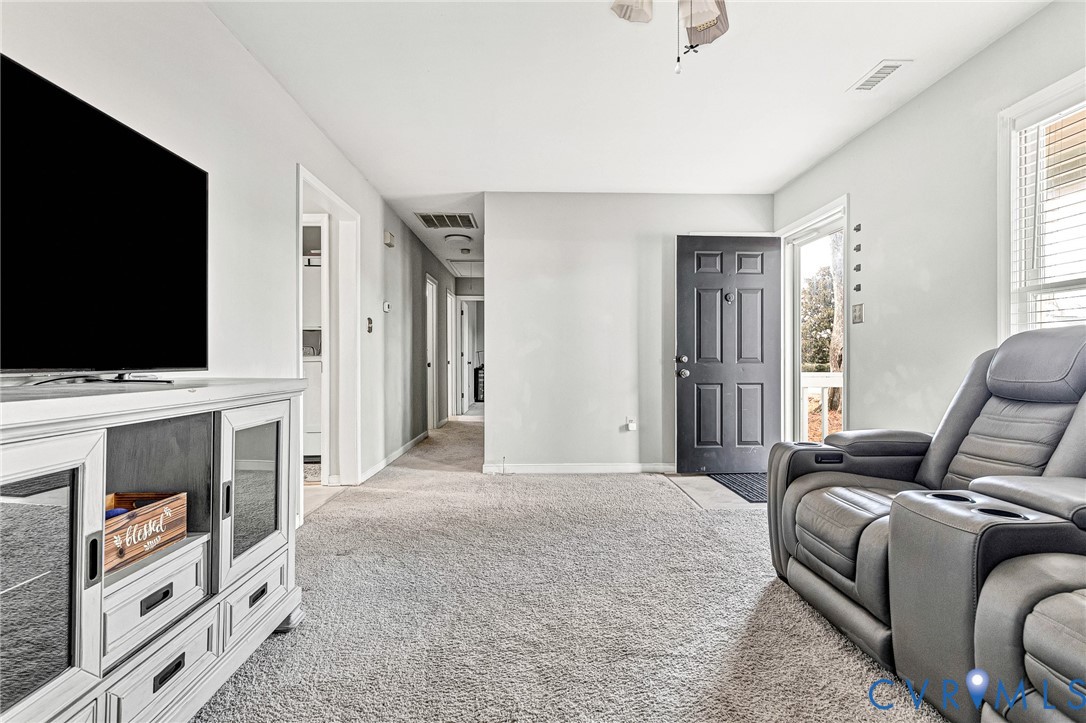 6377 Sledds Lake Road Mechanicsville, VA 23111 - Photo 4 of 15 a bedroom with furniture and a flat screen tv