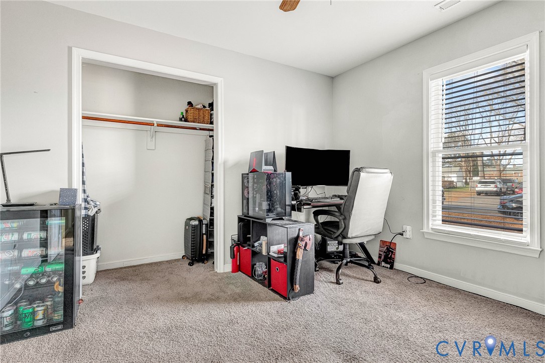 6377 Sledds Lake Road Mechanicsville, VA 23111 - Photo 8 of 15 a view of a workspace with furniture and a window