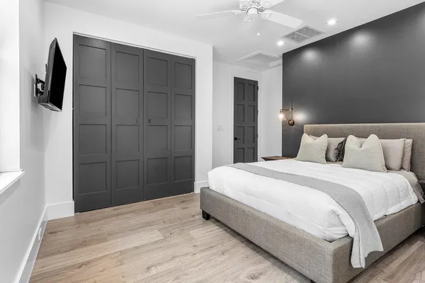 a bedroom with a bed and a table