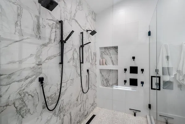 a kitchen with stainless steel appliances a sink a stove and a refrigerator