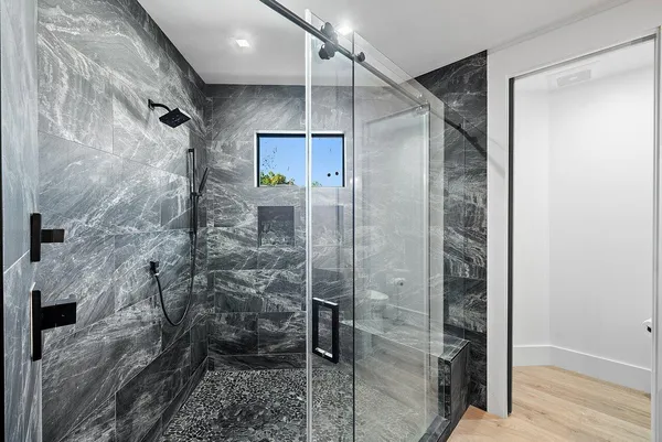 an aerial view of a house with a garden and statue