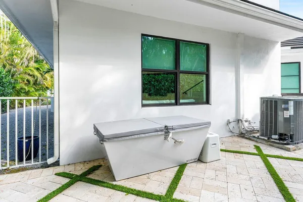 a view of a swimming pool with an outdoor seating