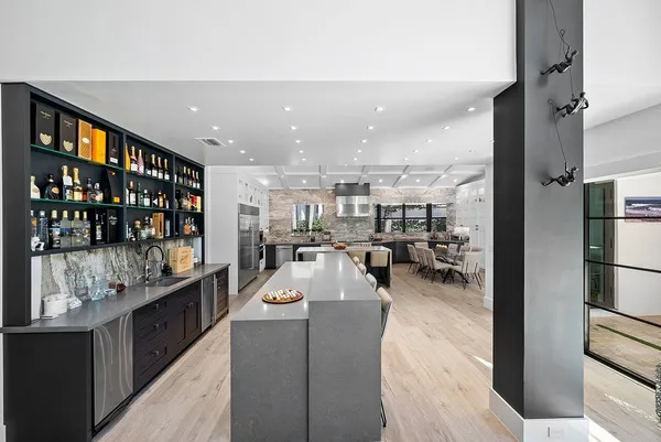 a kitchen with stainless steel appliances granite countertop a sink and cabinets