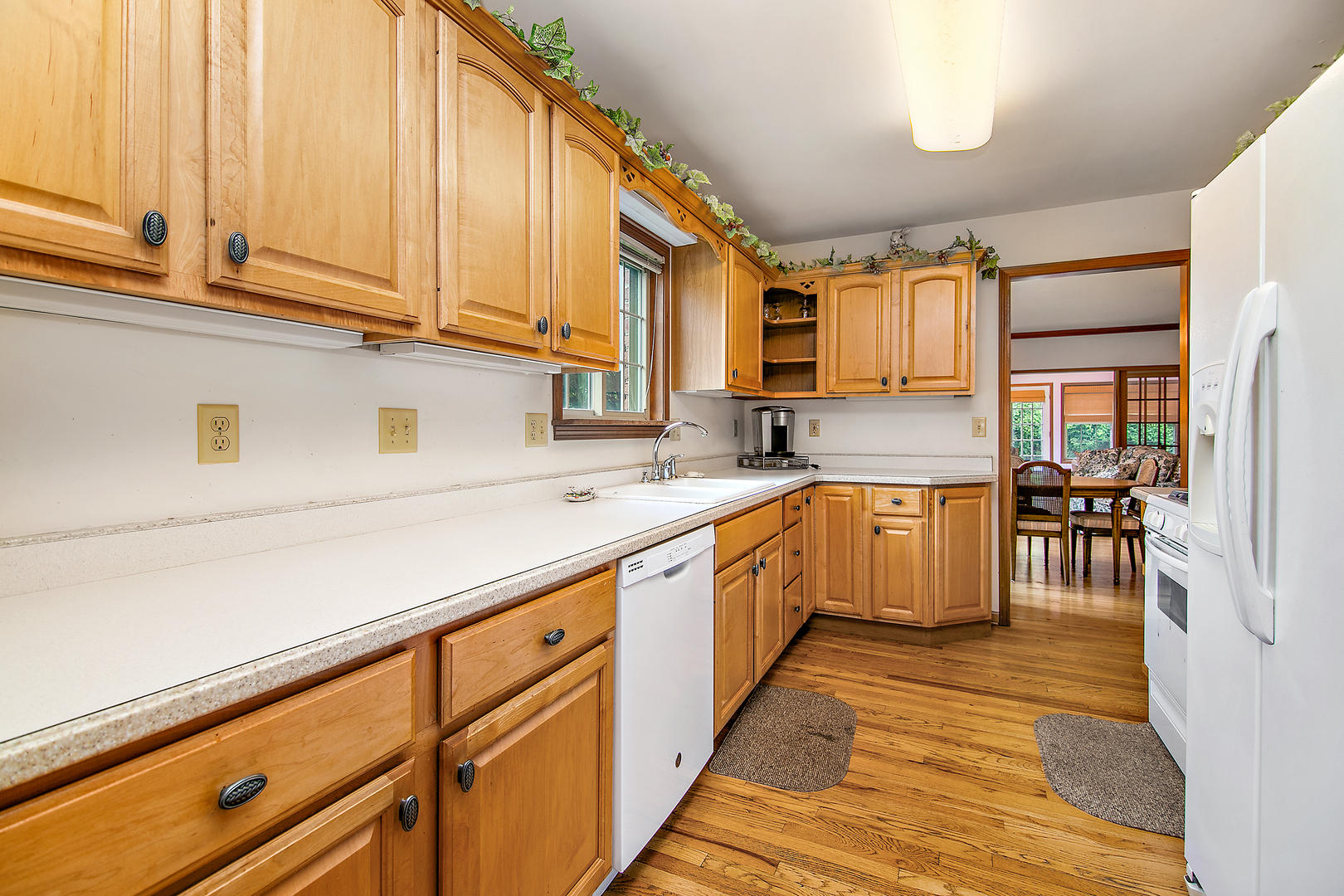 548 Olde Oak Drive, Unit 548 Bourbonnais, IL 60914 - Photo 13 of 26 a kitchen with stainless steel appliances granite countertop a sink and cabinets