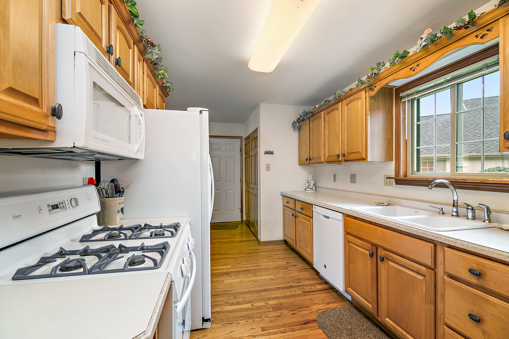 548 Olde Oak Drive, Unit 548 Bourbonnais, IL 60914 - Photo 14 of 26 a kitchen with stainless steel appliances granite countertop a sink and a stove