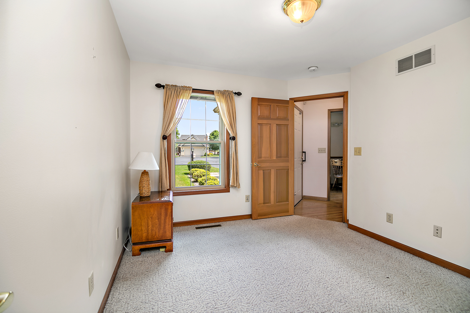 548 Olde Oak Drive, Unit 548 Bourbonnais, IL 60914 - Photo 16 of 26 a view of an empty room with a window