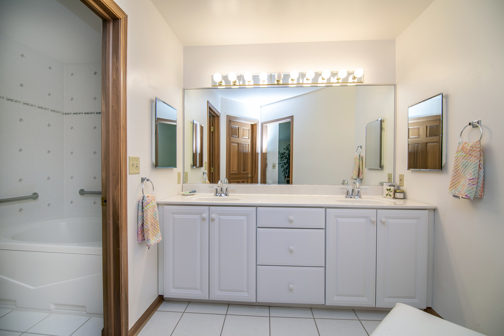 548 Olde Oak Drive, Unit 548 Bourbonnais, IL 60914 - Photo 18 of 26 a bathroom with a double vanity sink and a mirror