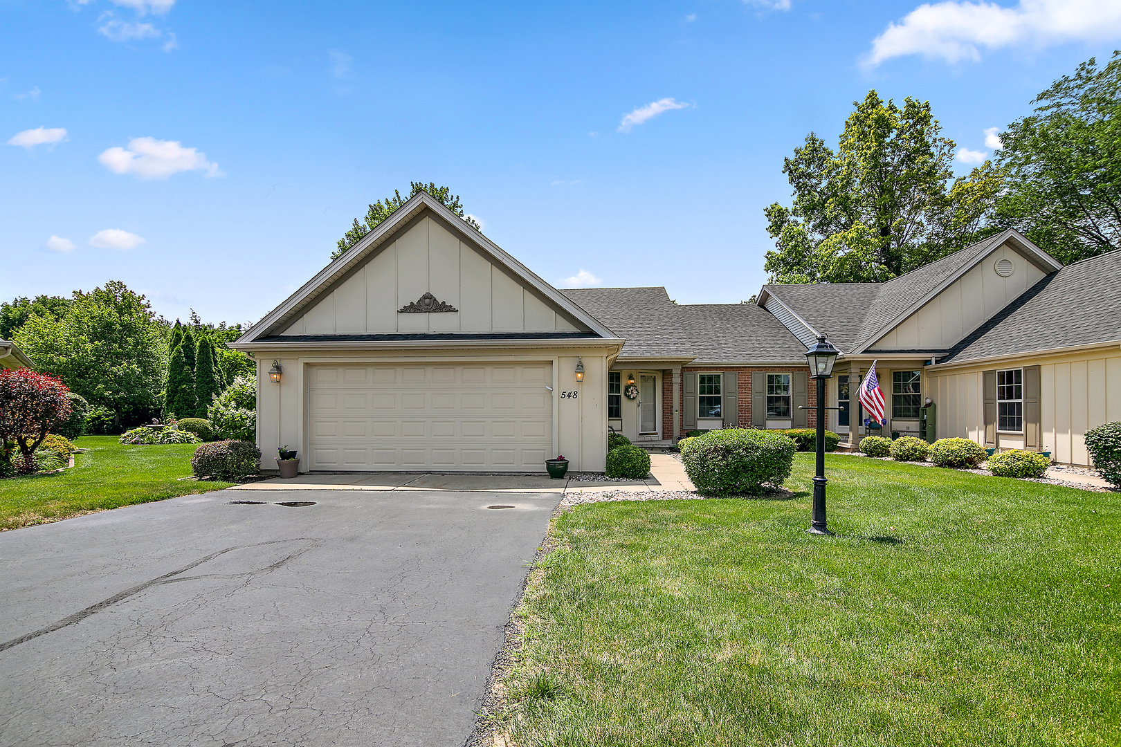 548 Olde Oak Drive, Unit 548 Bourbonnais, IL 60914 - Photo 2 of 26 a front view of a house with a yard and garage
