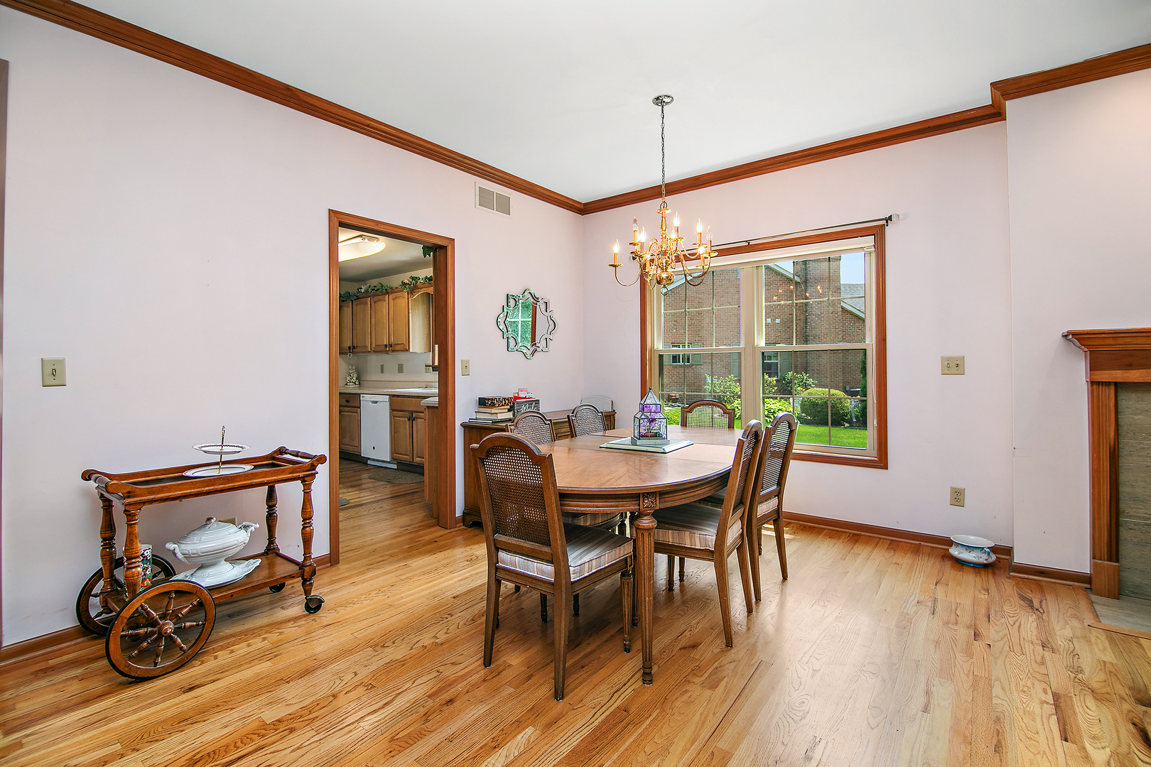 548 Olde Oak Drive, Unit 548 Bourbonnais, IL 60914 - Photo 8 of 26 a view of a dining room with furniture and wooden floor