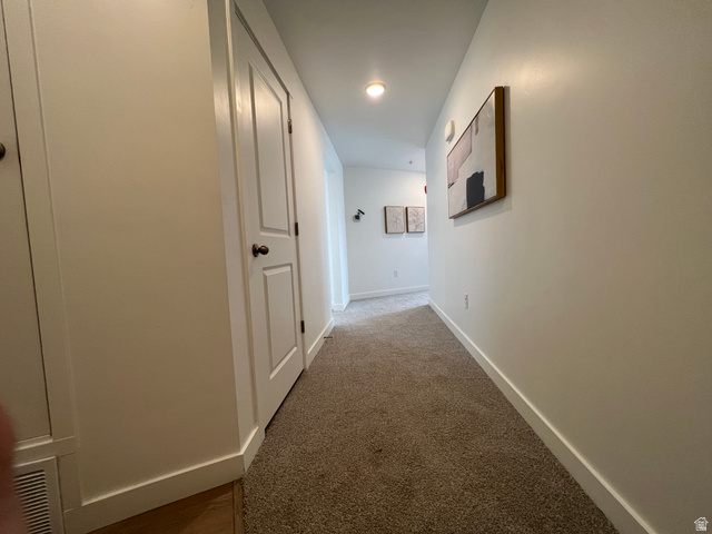 718 West Blue Magic Lane, Unit S201 Midvale, UT 84047 - Photo 13 of 18 Corridor featuring dark carpet and recessed lighting