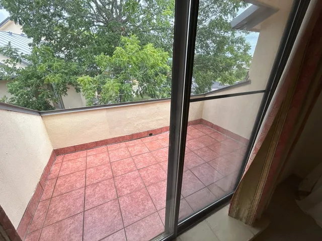 a front view of building with yard