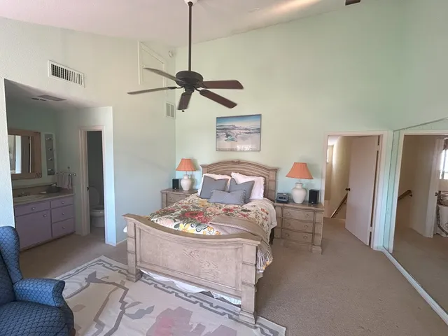 a dining room with furniture and a chandelier