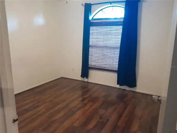 a view of a bathroom from a door