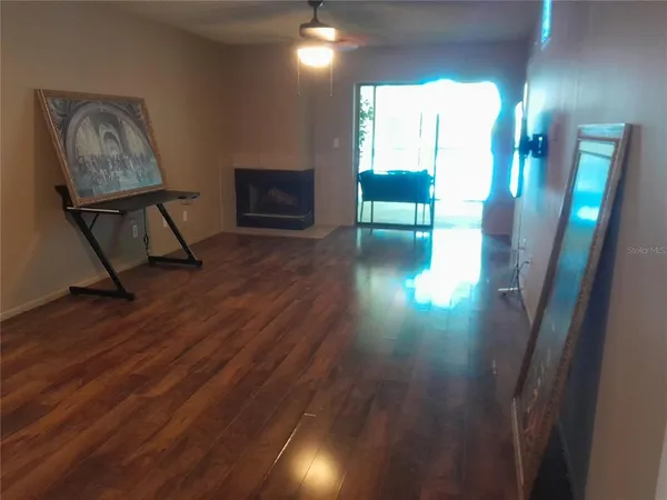 a workspace with wooden floor and a cabinet