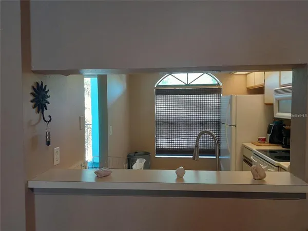 a view of wooden floor and windows in a room