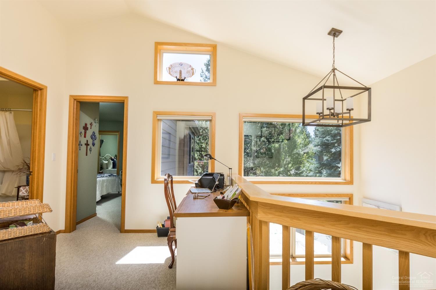 17651 Bittern Lane Sunriver, OR 97707 - Photo 19 of 25 The upstairs landing works well as a off