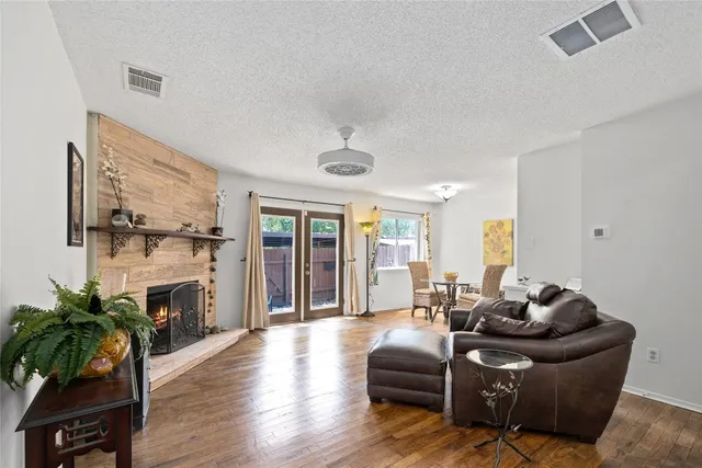 a living room with furniture flat screen tv and a fireplace
