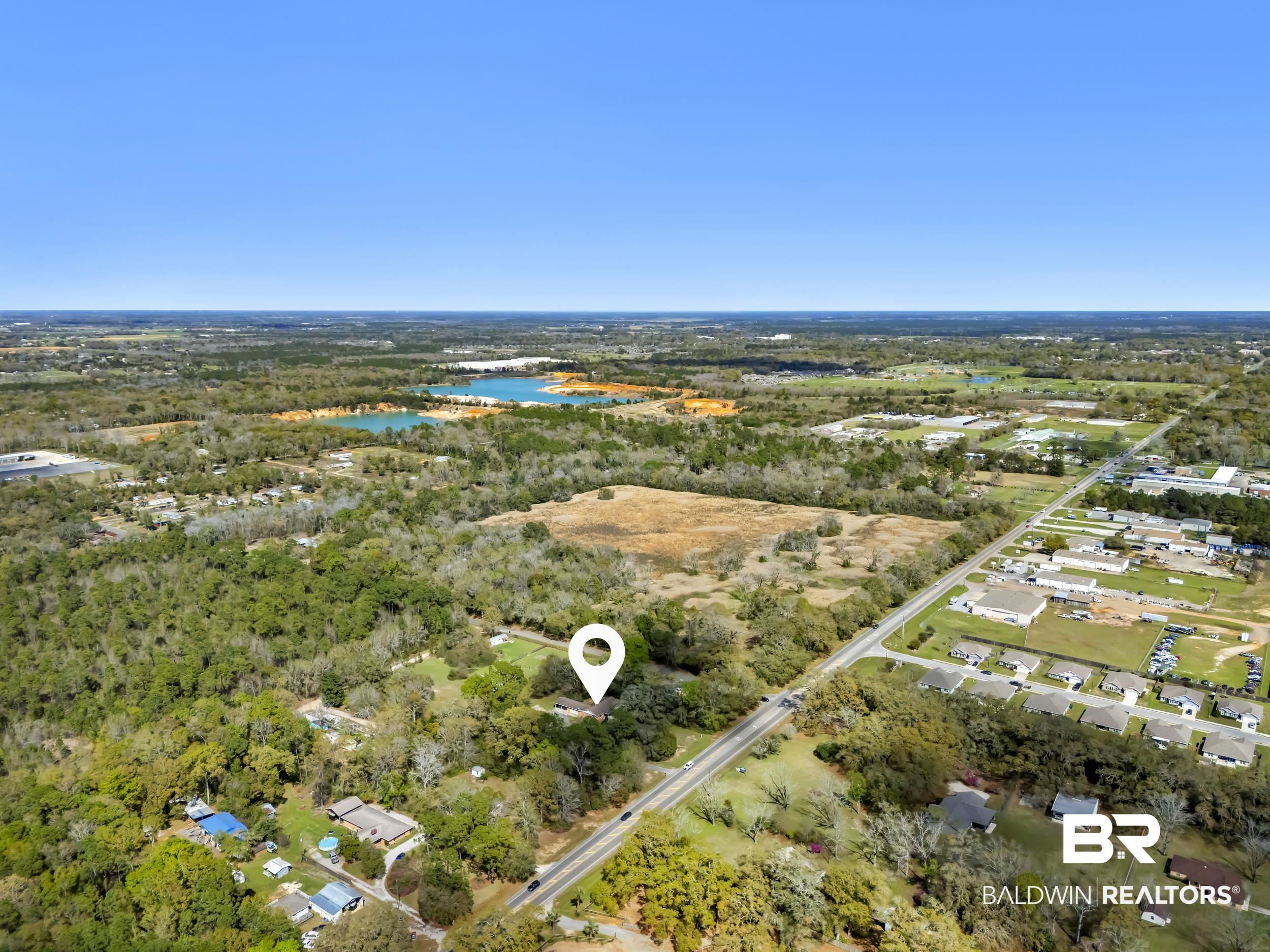 17463 Highway 98 Foley, AL 36535 - Photo 50 of 57 Bird's eye view of a large body of water and a heavily wooded area