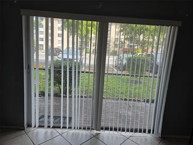 a view of a balcony with a floor to ceiling window
