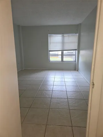 a view of empty room with windows