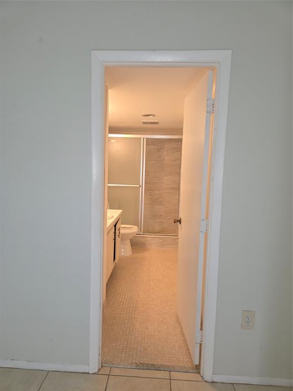 4158 Inverrary Drive, Unit 104 Lauderhill, FL 33319 - Photo 18 of 40 a view of a closet area with living room