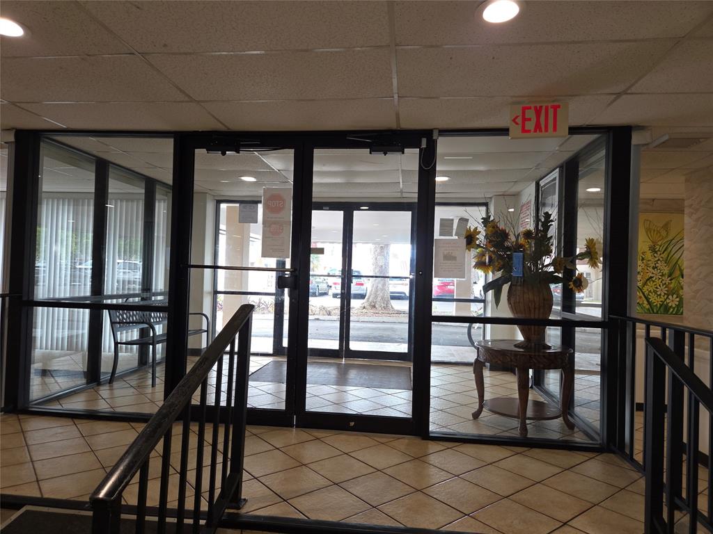 4158 Inverrary Drive, Unit 104 Lauderhill, FL 33319 - Photo 2 of 40 an empty room with wooden floor and windows