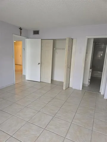 an empty room with a bathroom