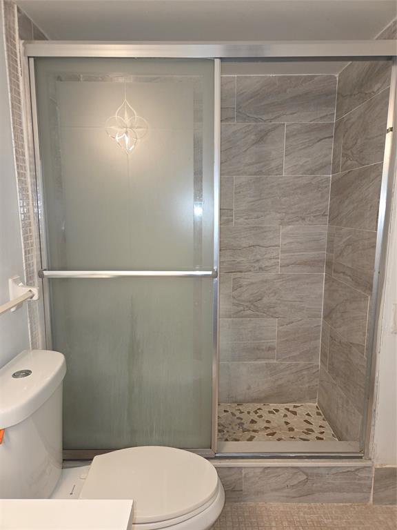 4158 Inverrary Drive, Unit 104 Lauderhill, FL 33319 - Photo 27 of 40 a bathroom with a toilet and a shower