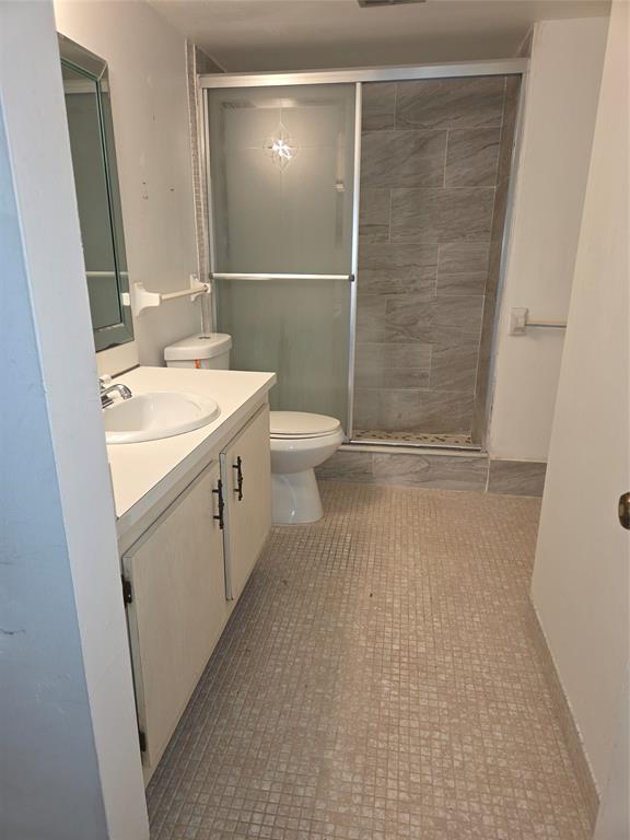 4158 Inverrary Drive, Unit 104 Lauderhill, FL 33319 - Photo 28 of 40 a bathroom with a sink a toilet and shower