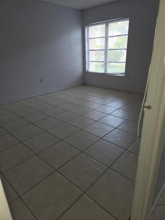 4158 Inverrary Drive, Unit 104 Lauderhill, FL 33319 - Photo 35 of 40 an empty room with a window