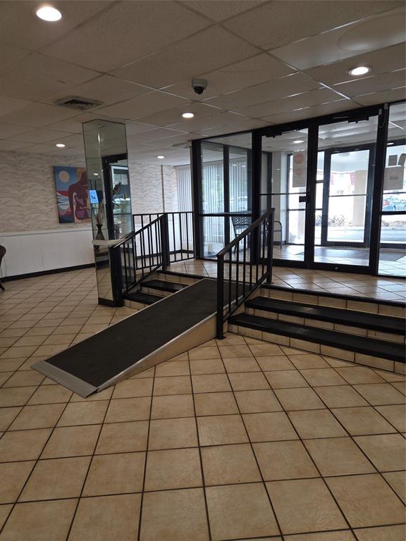 4158 Inverrary Drive, Unit 104 Lauderhill, FL 33319 - Photo 5 of 40 a lobby with glass door