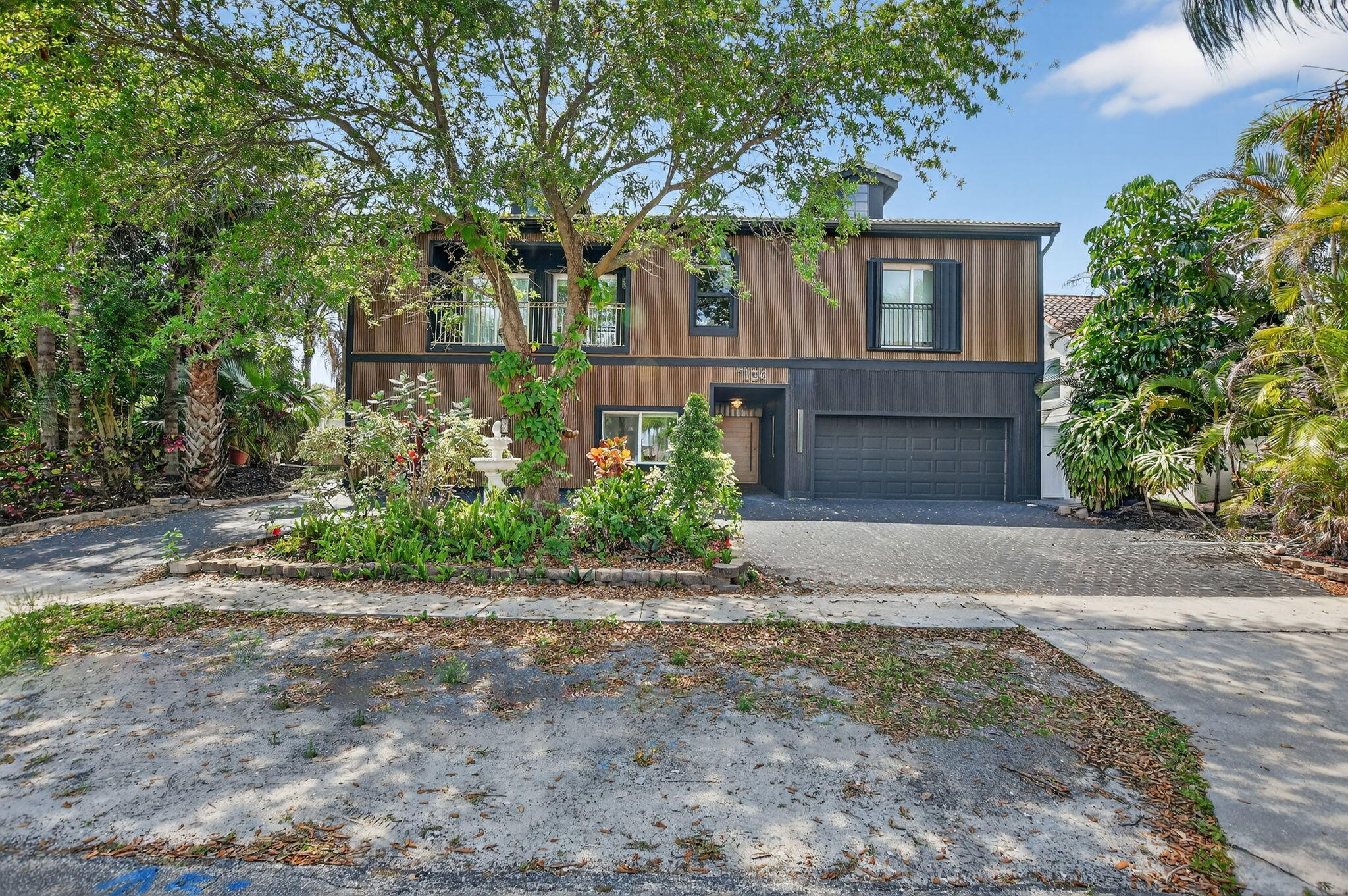 7134 San Sebastian Drive Boca Raton, FL 33433 - Photo 1 of 73 front view of a house with a trees