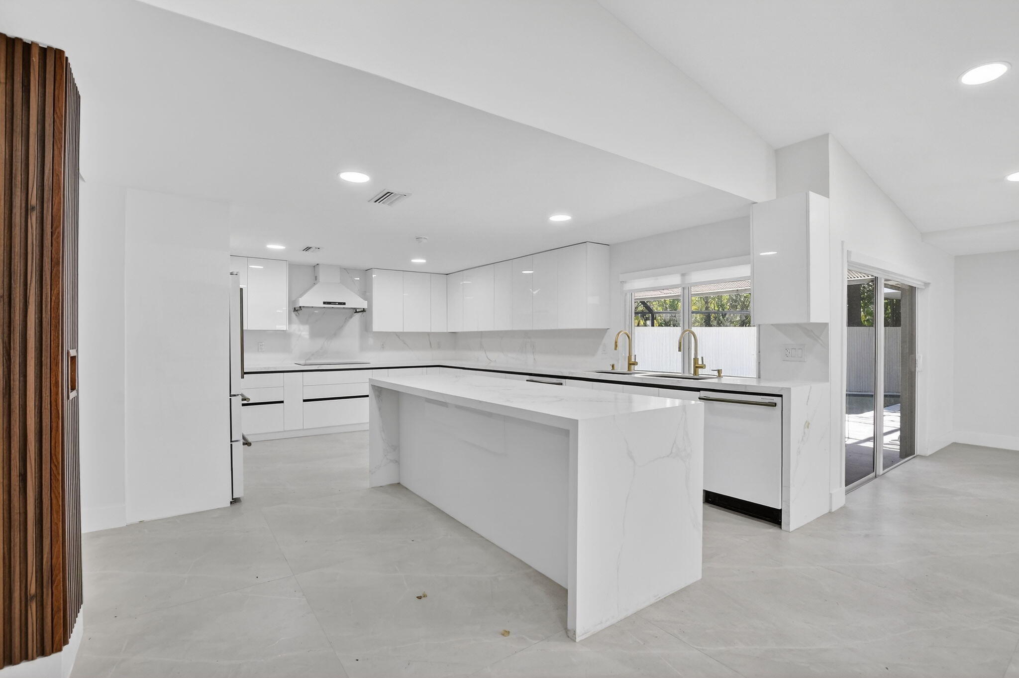7134 San Sebastian Drive Boca Raton, FL 33433 - Photo 13 of 73 a large white kitchen with stainless steel appliances double vanity and a refrigerator