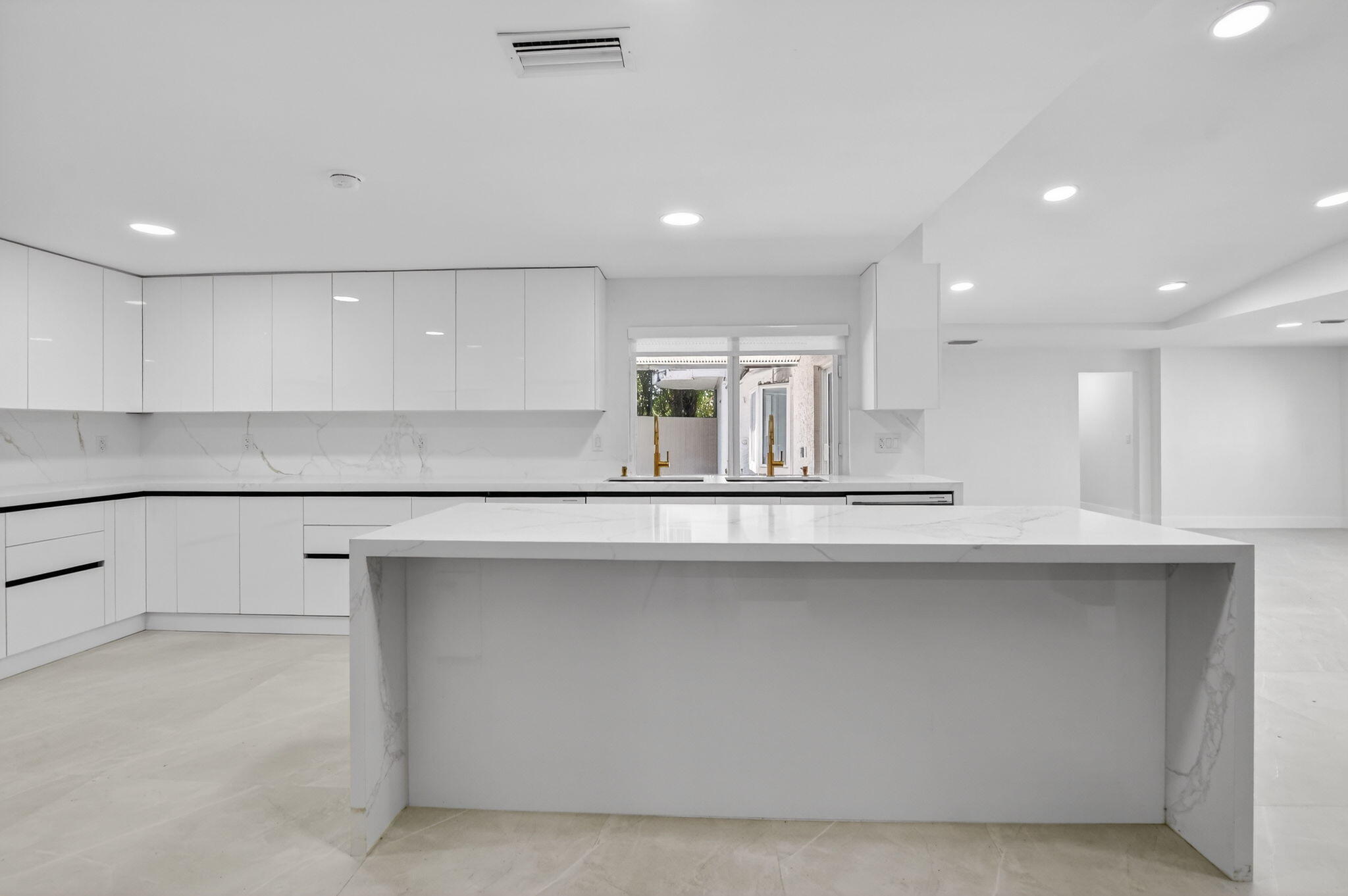 7134 San Sebastian Drive Boca Raton, FL 33433 - Photo 14 of 73 a kitchen with counter top space cabinets and appliances