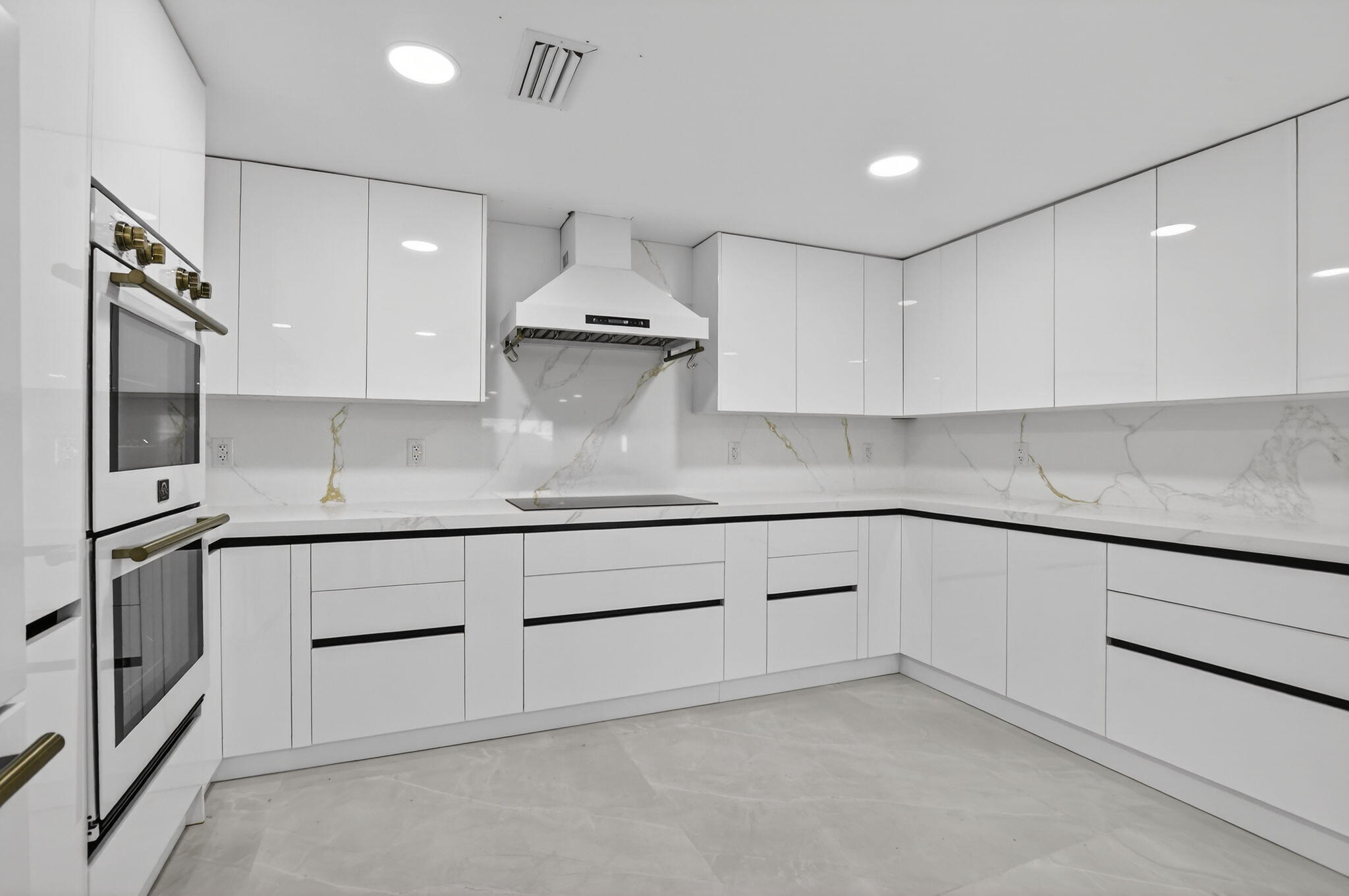 7134 San Sebastian Drive Boca Raton, FL 33433 - Photo 15 of 73 a kitchen with granite countertop white cabinets and stainless steel appliances