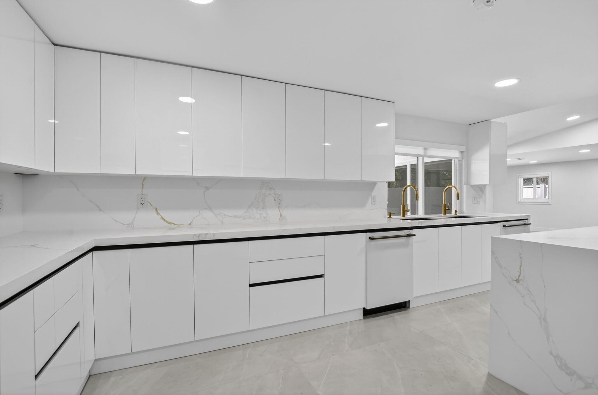 7134 San Sebastian Drive Boca Raton, FL 33433 - Photo 17 of 73 a kitchen with granite countertop white cabinets and sink