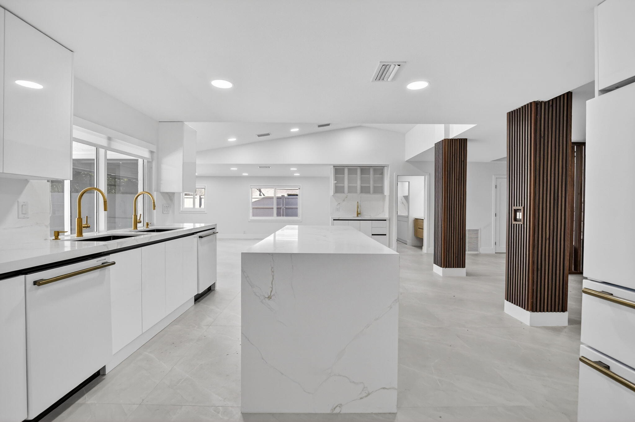 7134 San Sebastian Drive Boca Raton, FL 33433 - Photo 18 of 73 a large kitchen with stainless steel appliances a refrigerator and a sink