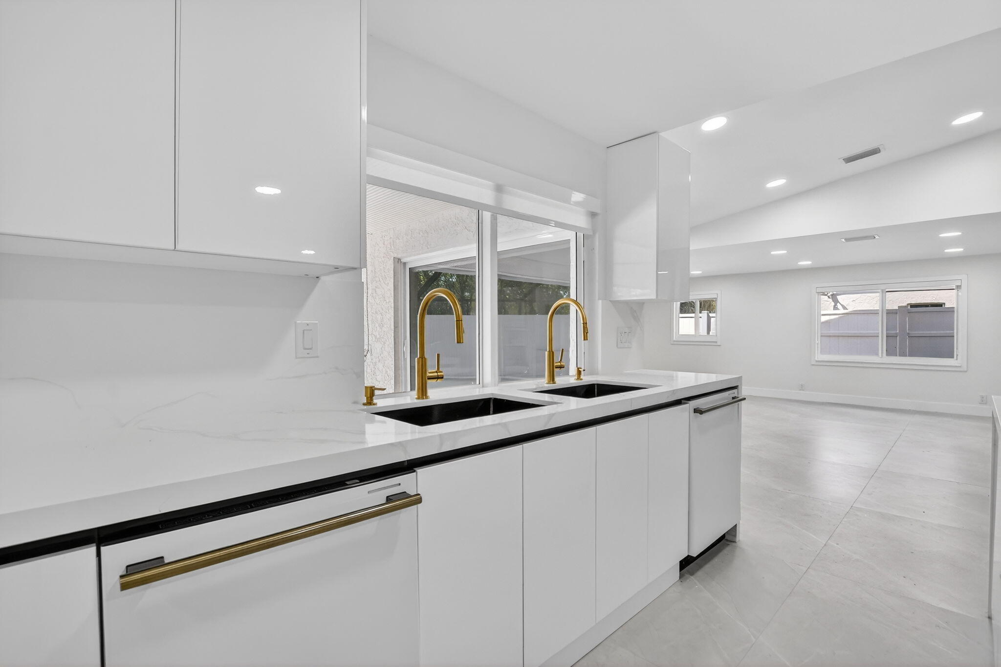 7134 San Sebastian Drive Boca Raton, FL 33433 - Photo 19 of 73 a kitchen with stainless steel appliances a sink and a counter top