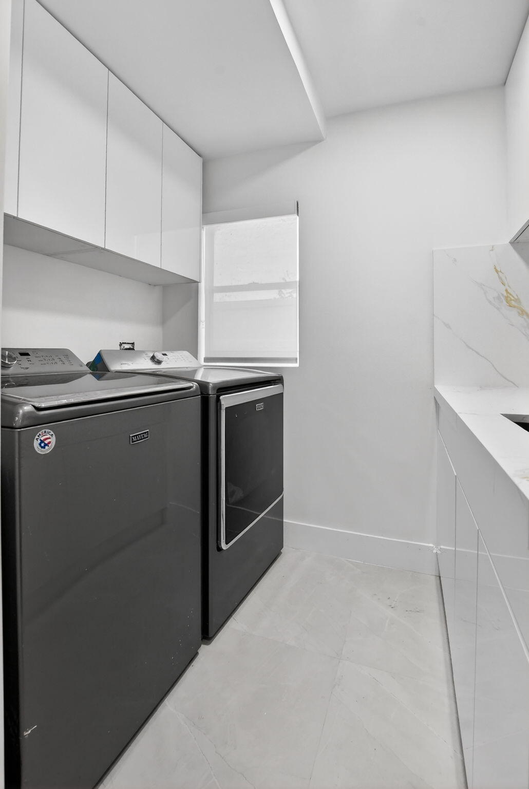 7134 San Sebastian Drive Boca Raton, FL 33433 - Photo 24 of 73 a kitchen with stainless steel appliances a sink stove and cabinets