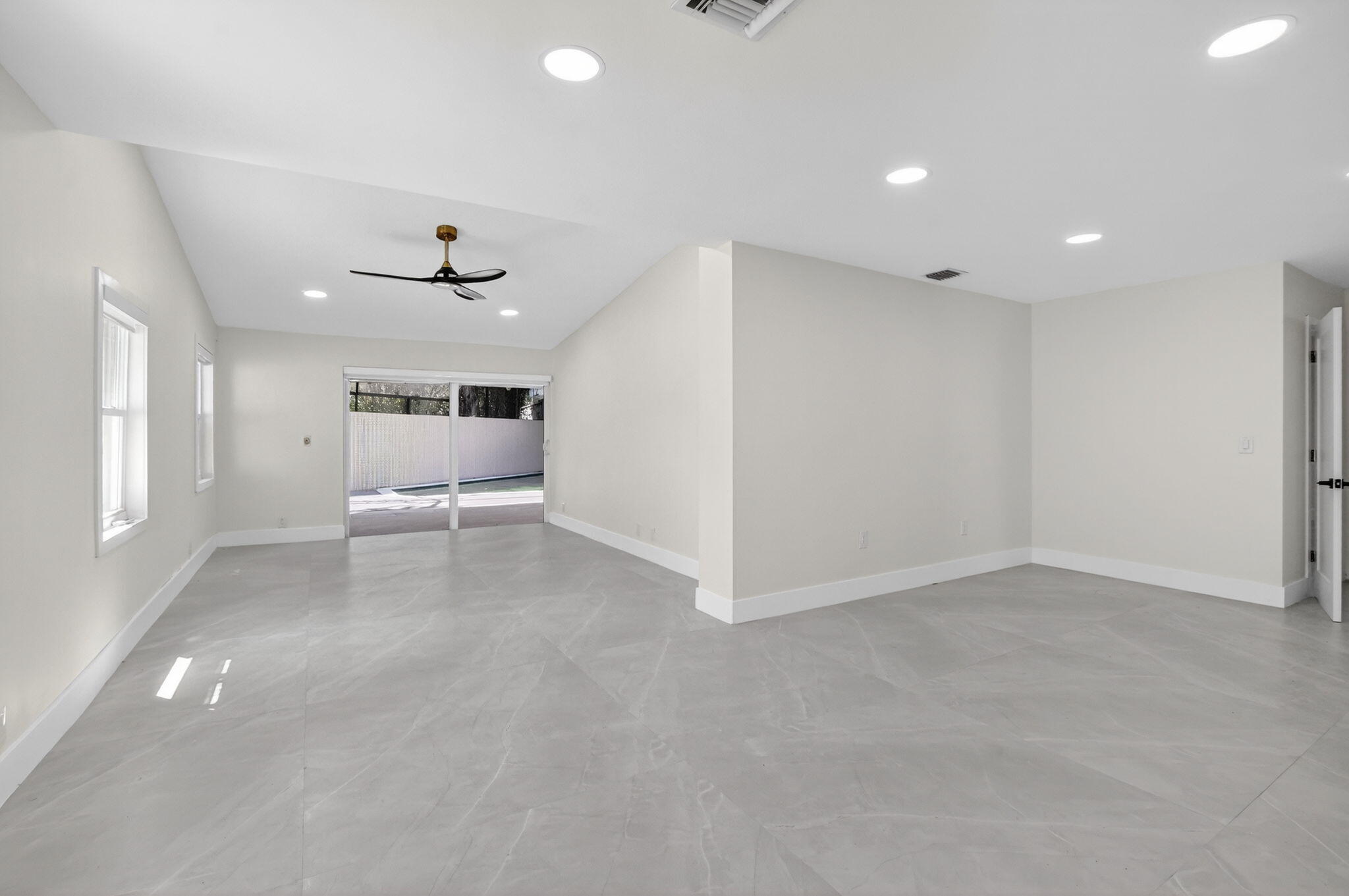 7134 San Sebastian Drive Boca Raton, FL 33433 - Photo 27 of 73 wooden floor in an empty room with a window