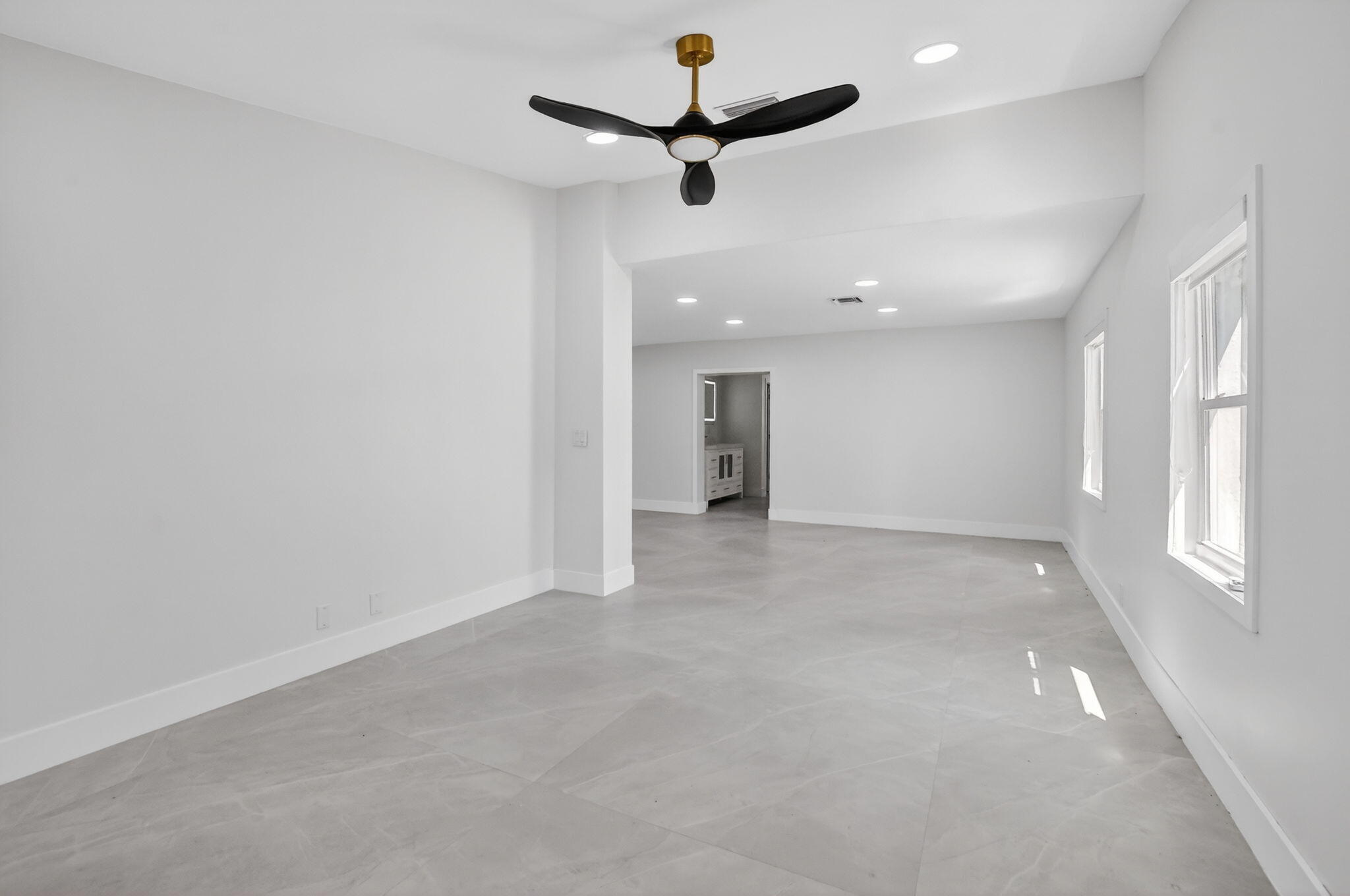 7134 San Sebastian Drive Boca Raton, FL 33433 - Photo 30 of 73 an empty room with a ceiling fan and a window