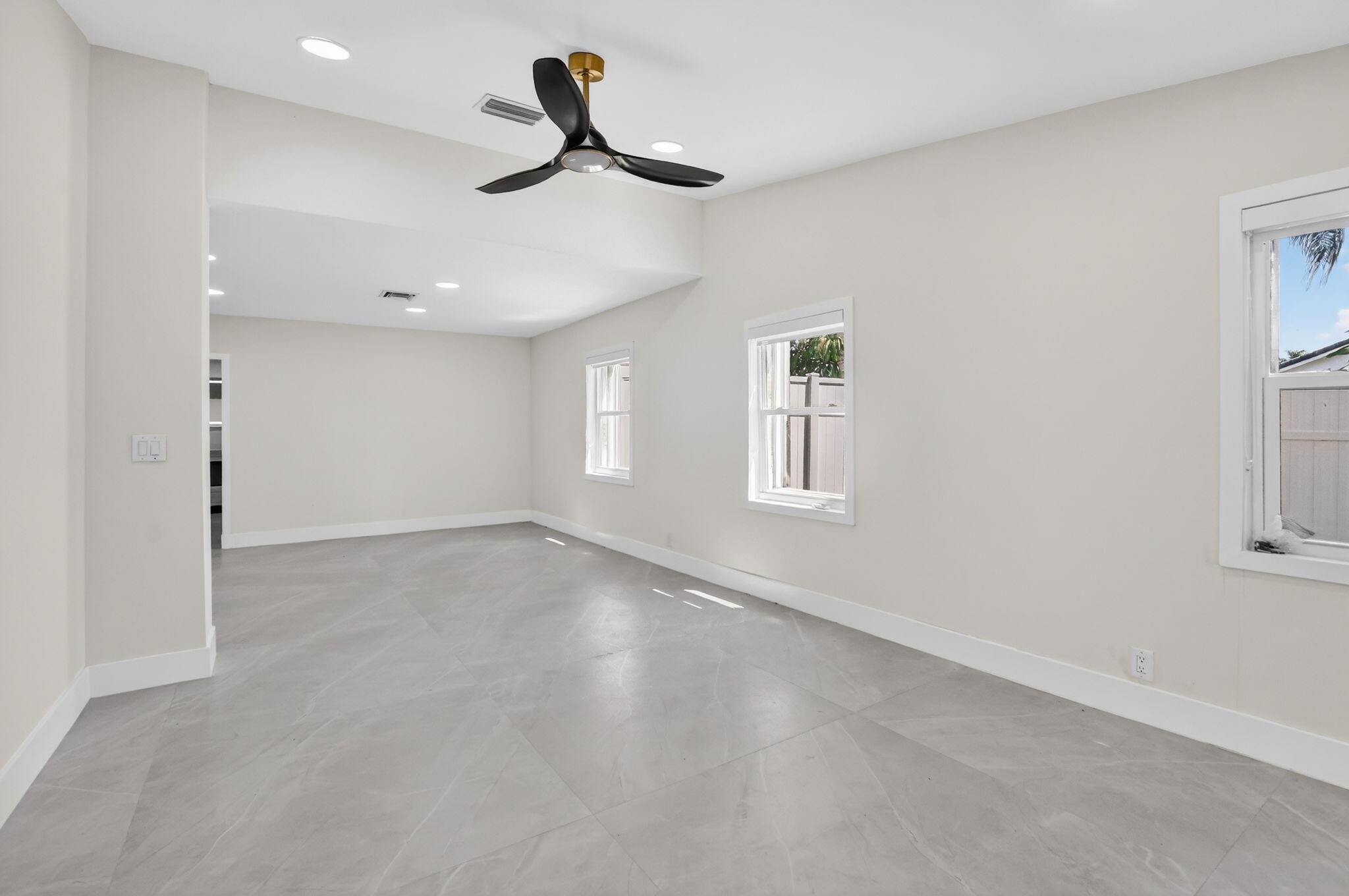 7134 San Sebastian Drive Boca Raton, FL 33433 - Photo 31 of 73 wooden floor in an empty room with a window