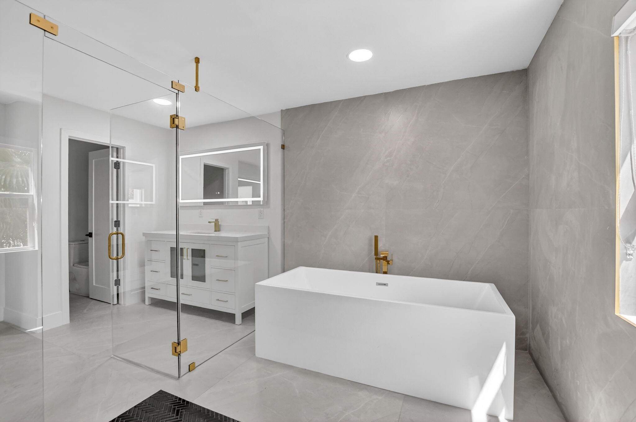 7134 San Sebastian Drive Boca Raton, FL 33433 - Photo 37 of 73 a bathroom with a sink a mirror and a shower