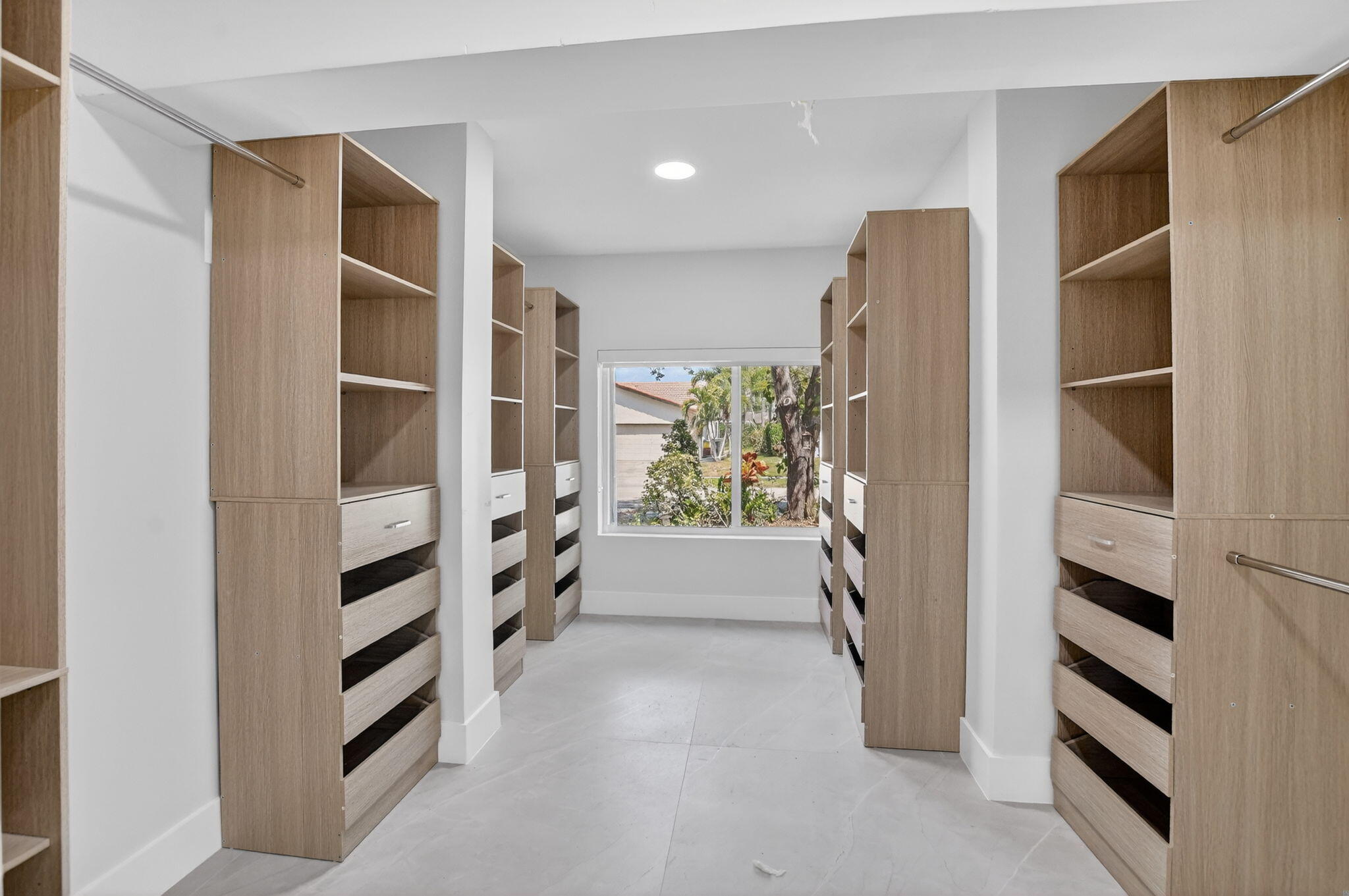 7134 San Sebastian Drive Boca Raton, FL 33433 - Photo 41 of 73 a view of walk in closet with empty racks
