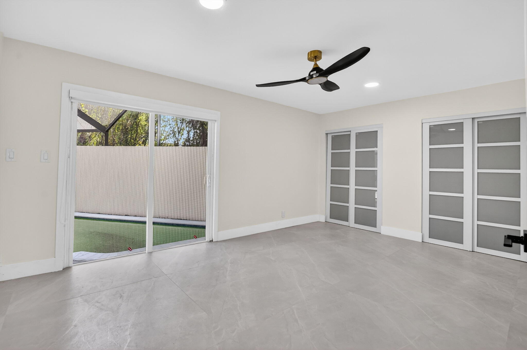 7134 San Sebastian Drive Boca Raton, FL 33433 - Photo 44 of 73 an empty room with windows