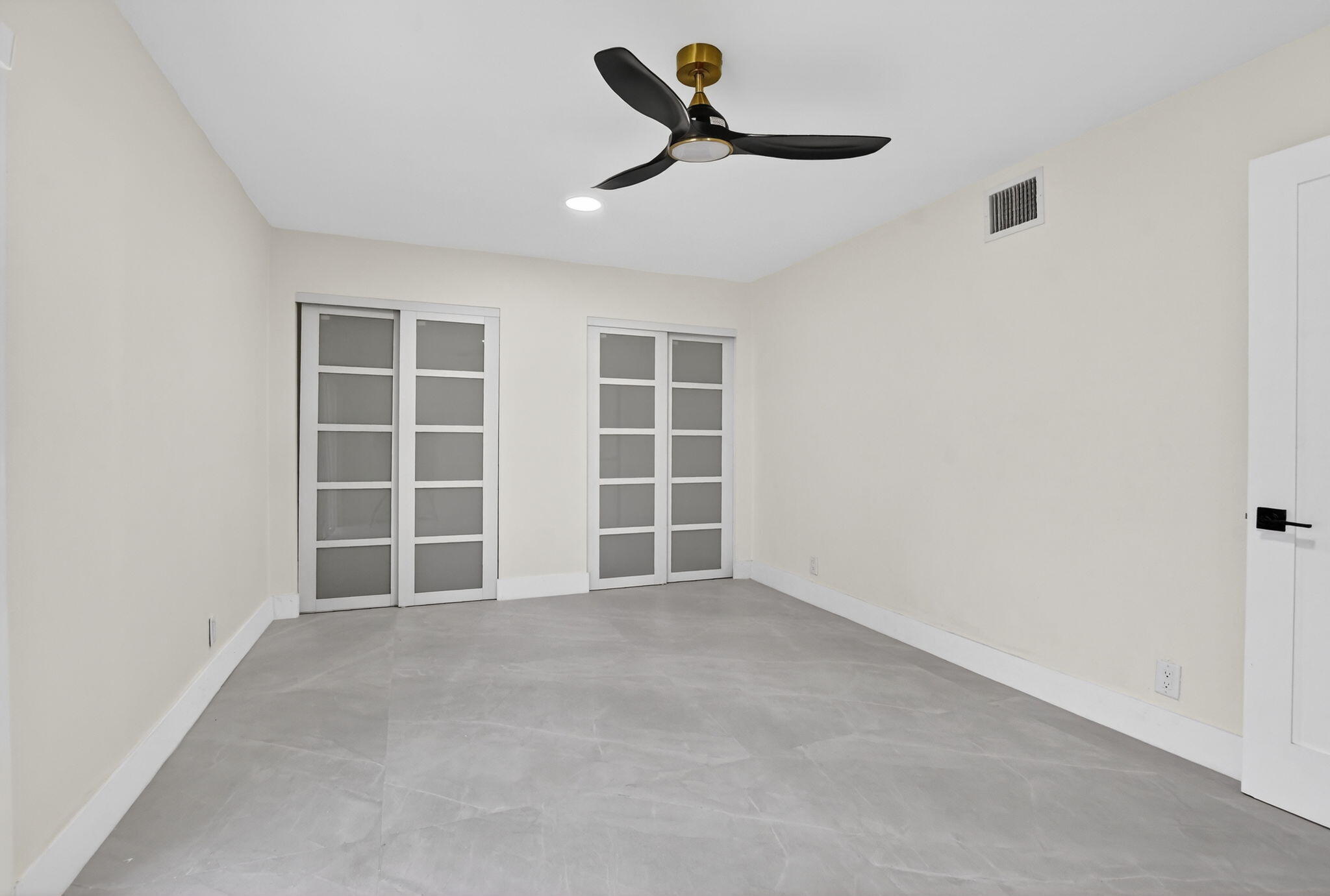 7134 San Sebastian Drive Boca Raton, FL 33433 - Photo 45 of 73 an empty room with a empty space and windows