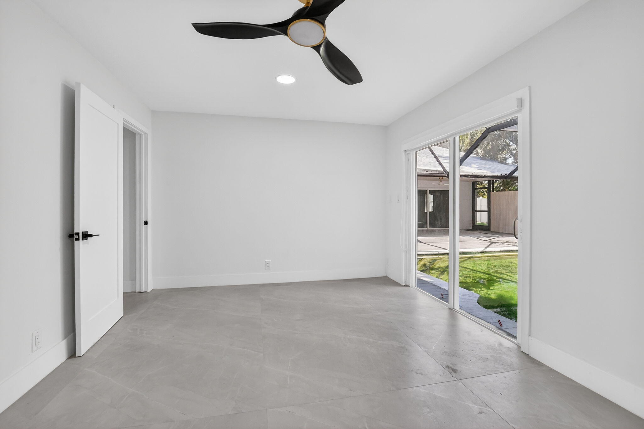7134 San Sebastian Drive Boca Raton, FL 33433 - Photo 46 of 73 wooden floor in an empty room with a window