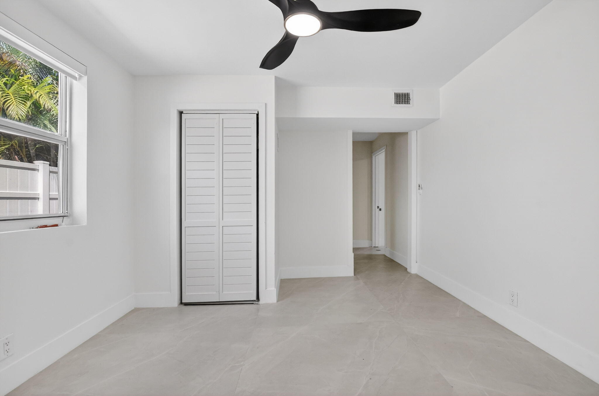 7134 San Sebastian Drive Boca Raton, FL 33433 - Photo 49 of 73 an empty room with windows and closet